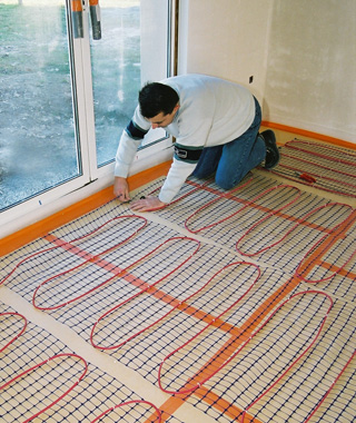 Plancher rayonnant électrique avant coulage de la chape